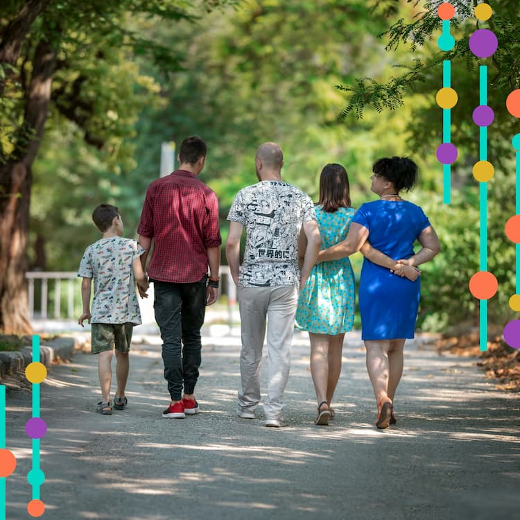 Multi Generational Family walking away from camera. Image overlaid with genetic symbols.